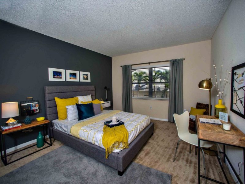 This image shows an expansive view of the Premium Apartment Feature, specifically the spacious bedroom area with elegant bedding and fabrics that was ideal for comfy living.