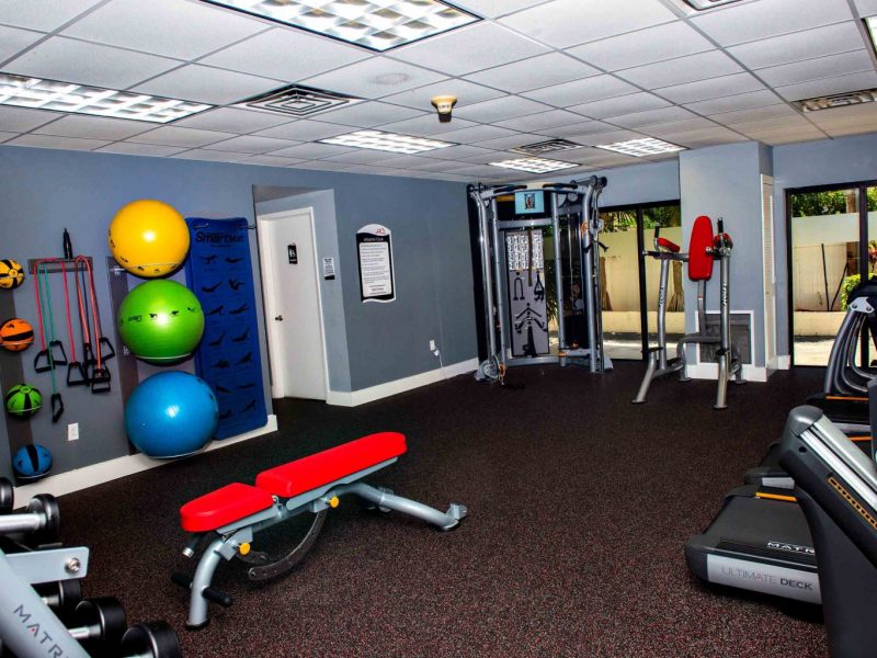 This image shows the 24-hour State-of-the-art fitness gym featuring different equipment that is essential for community amenities. The Athletic Club is also offering gym balls to test and apply proper balance.