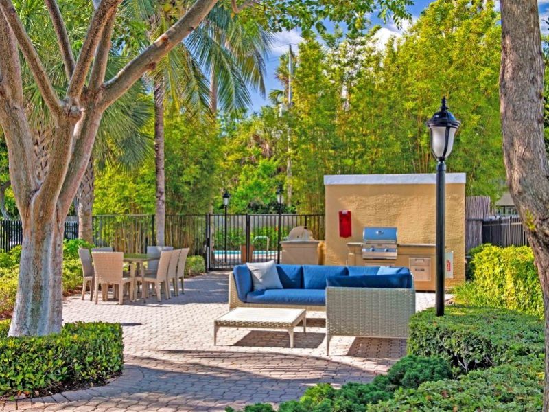 This image exhibits the comfy outdoor lounge with a shady environment and eco-friendly ambiance, a perfect place for relaxation, and leisure activity.
