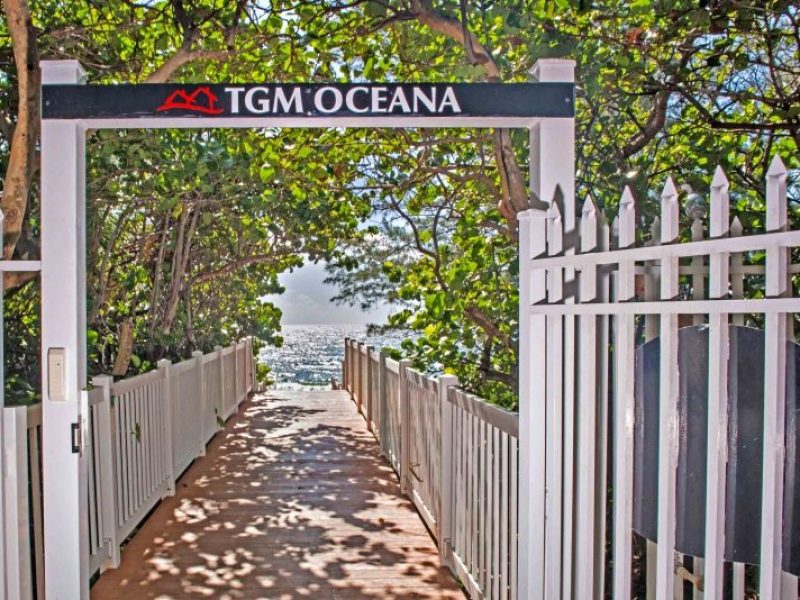 This image shows the gateway to the private beach in TGM Oceana, showcasing the dramatic aisle through the beach.